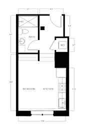 A floor plan of a small apartment with a bedroom, a kitchen, and a bathroom.