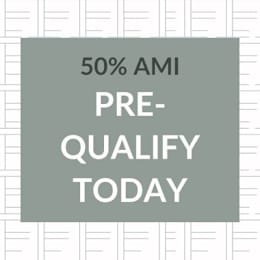 A sign that says 50% AMI Pre-Qualify Today.