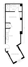 A floor plan of a small apartment with a bedroom, living room, and kitchen.