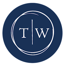 A blue circle with the letters T and W separated by a vertical line at Town Walk at Hamden Hills, Connecticut, 06518