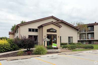 A building with a brown roof and a sign that says "1500" on it.