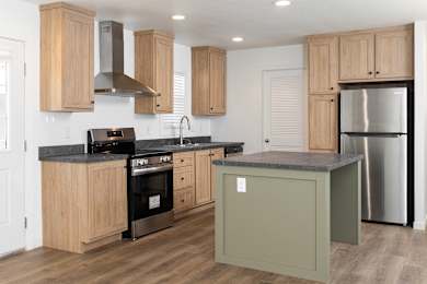 A kitchen with wooden cabinets and a black countertop.