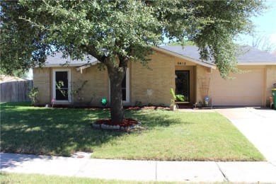 a house with a tree in front of it