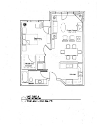 A floor plan of a one bedroom apartment with a great room, bedroom, walk-in closet, and kitchen.