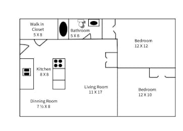 A floor plan of a small apartment with a living room, dining room, kitchen, two bedrooms, and bathrooms.