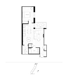 A black and white floor plan of a house with a kitchen, living room, and bathroom.