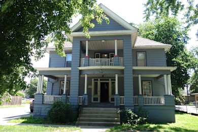 A two-story house with a front porch.
