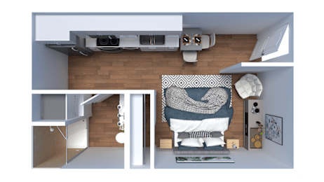 A modern living room with a grey couch and a grey and white patterned throw.
