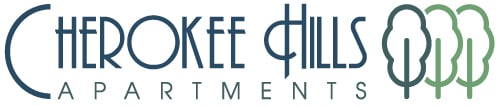 The logo for the company "Crooked Hills Apartments" consists of stylized text and three tree shapes.