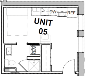 a floor plan of a small room with a bathroom and a desk