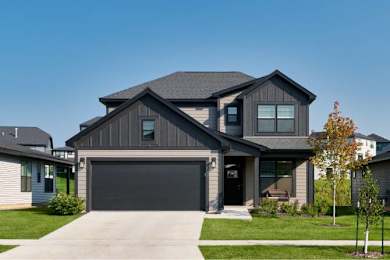 a house with a black garage door