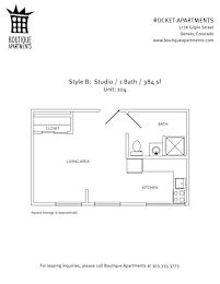 A drawing of a studio apartment layout with a kitchen, living area, and bathroom.
