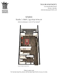 A black and white image of a studio apartment with a bathroom and a patio.