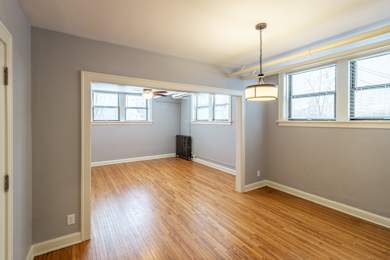 A room with wooden floors and white walls.