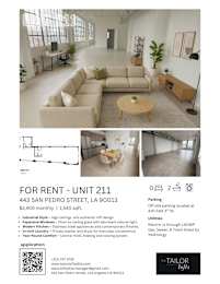 A living room with a couch, a coffee table, and a plant.