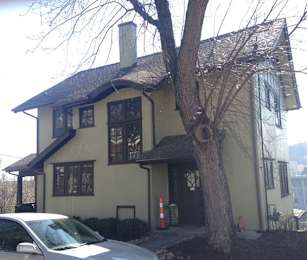 A house with a tree in front of it.at Maplehurst Apartments, Tennessee