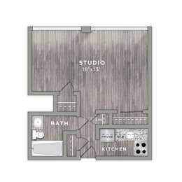 A floor plan of a studio apartment with a bath, kitchen, and studio space.
