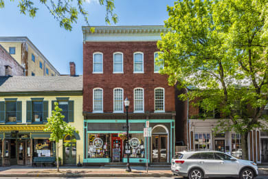 a building on a city street with a car