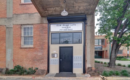 Floor Plan  a building with a black door and a white sign that says ell street lofts