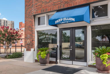 Floor Plan  a blue awning over a door with glass windows and a window sign that reads deep