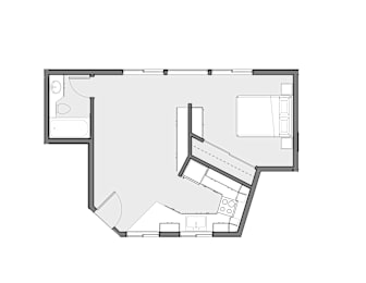 Floor Plan  A black and white floor plan of a house with a kitchen, living room, and bedrooms.