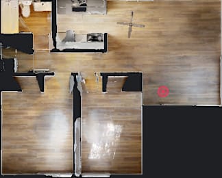 A top down view of a room with a red circle on the floor.
