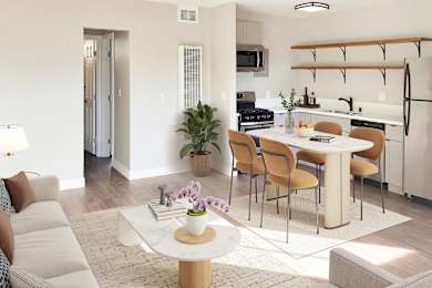 Modern living room with white sofa at Wilson Apartments, Glendale, CA