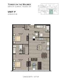 A diagram of a 2 bedroom/2 bath apartment with a living room and a kitchen.