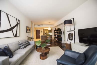 Floor Plan  a living room with a couch and a tv