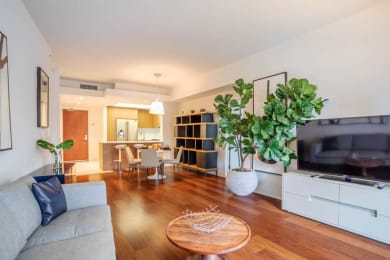 Floor Plan  a living room with a couch and a television