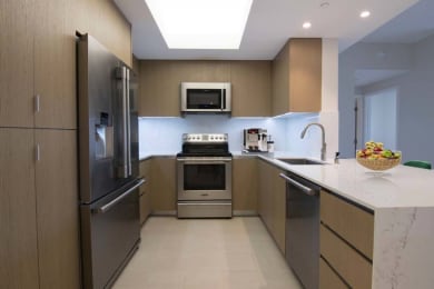 Floor Plan  a kitchen with stainless steel appliances and a sink