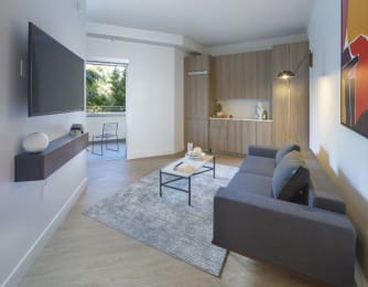 Floor Plan  a living room with a couch and a television