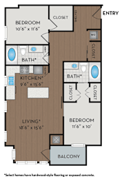 A floor plan of a home with a living room, kitchen, two bedrooms and two bathrooms.
