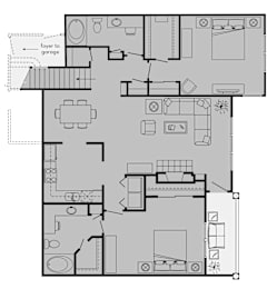 A floor plan of a house with a foyer leading to a garage.