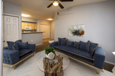 a living room with blue couches and a coffee table at Ashton Oaks, Florida, 34654
