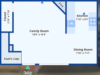 A blue and white floor plan of a house with a family room, kitchen, dining room, closet, and stairs.