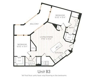 Two-bedroom apartment with entry into the kitchen featuring an island and adjacent living/dining area with oversized balcony access. Split-bedroom layout with each bedroom offering nearby bathroom access and closet space. Primary bedroom includes dual vanities and a larger closet. In-unit washer and dryer included.