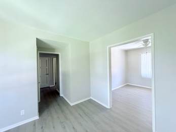 A room with a doorway leading to another room.