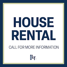 A sign that says "House Rental" and "Call for more information" is displayed.