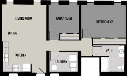 A floor plan of a small apartment with a living room, dining area, kitchen, laundry room, and two bedrooms.