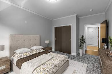 a bedroom with a bed and a door to a bathroom at Nineteen North Apartments , Buffalo, 14202