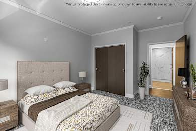 a bedroom with a bed and a door to a bathroom at Nineteen North Apartments , Buffalo, 14202