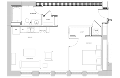 A floor plan of a house with a living room, kitchen, and two bedrooms.