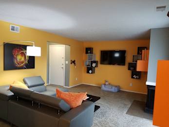 a living room with a couch and a tv