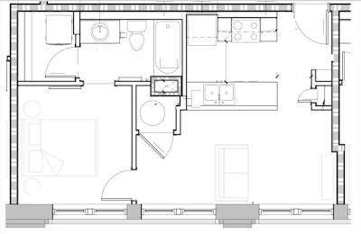A floor plan of a house with a kitchen, living room, and bathroom.