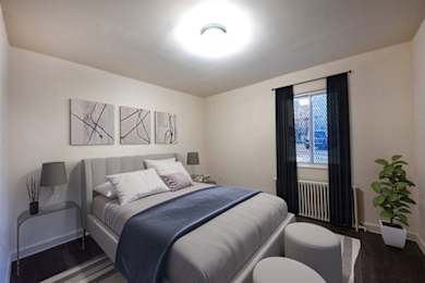 a small bedroom with a bed and a window
