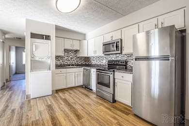 Kitchen with a refrigerator, oven, and microwave at Summit Terrace, Maine, 4106