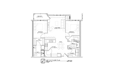 A floor plan of a house with a kitchen, living room, and bathrooms.