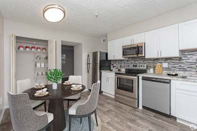 A Kitchen With Dining Table at Avondale Place Apartments, Georgia