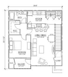 A floor plan of a small apartment with a bedroom, living room, kitchen, and bathroom.